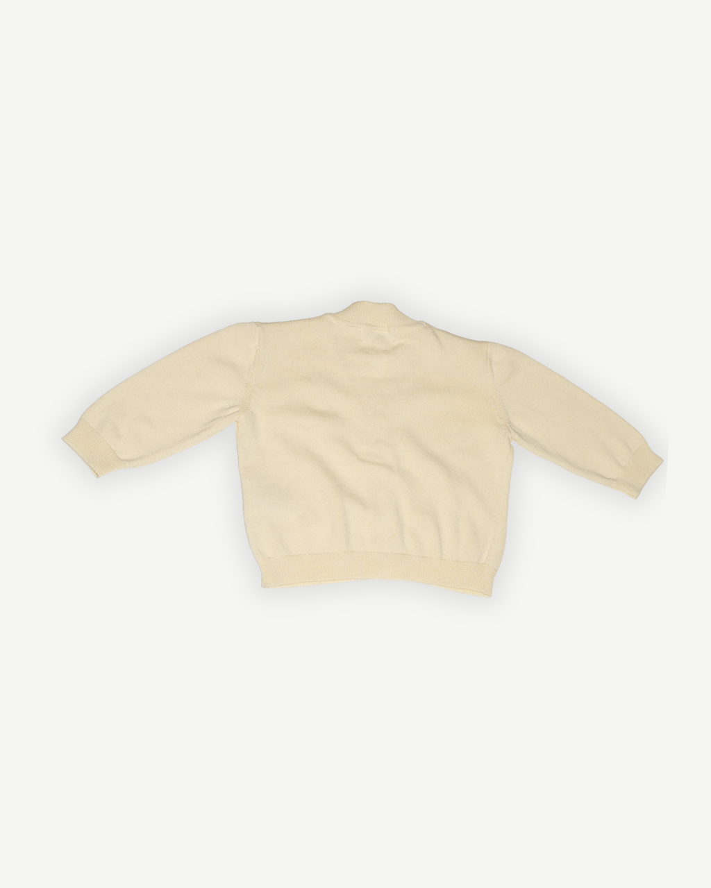 de achterkant van de butter yellow merino wollen vestje van besito baby