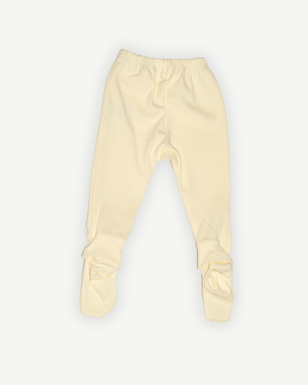 de achterkant van de botergele legging van besito baby in butter yellow