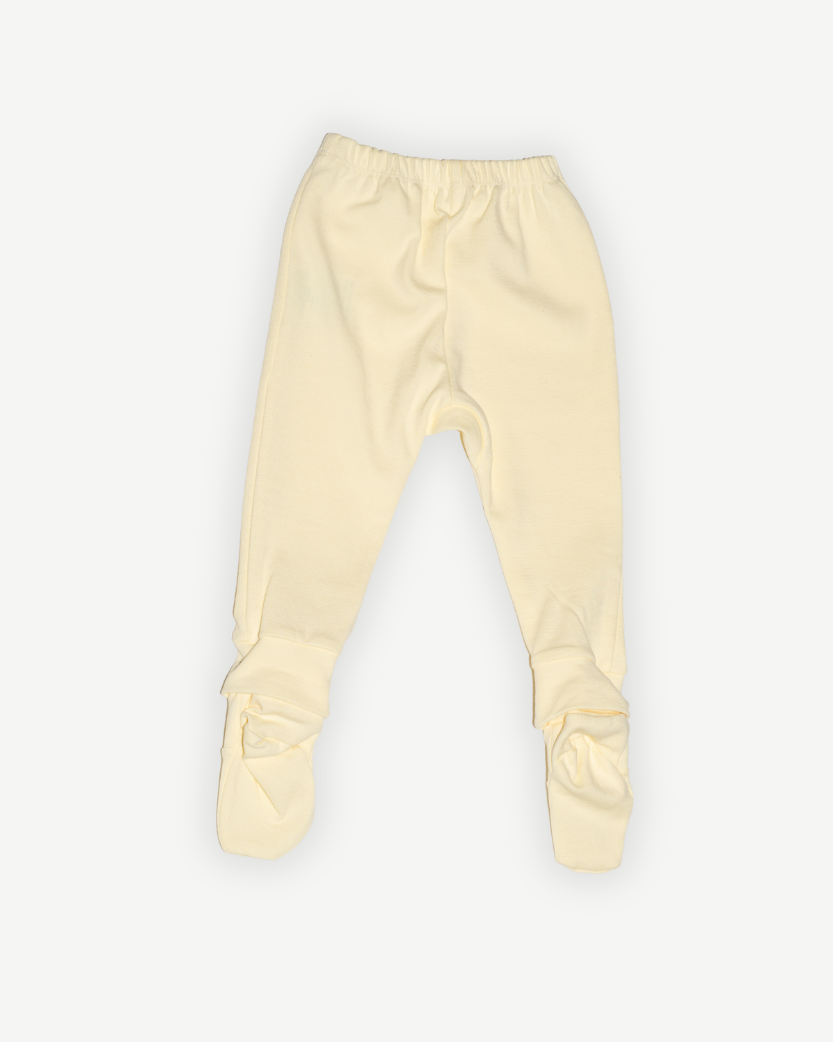de achterkant van de botergele legging van besito baby in butter yellow