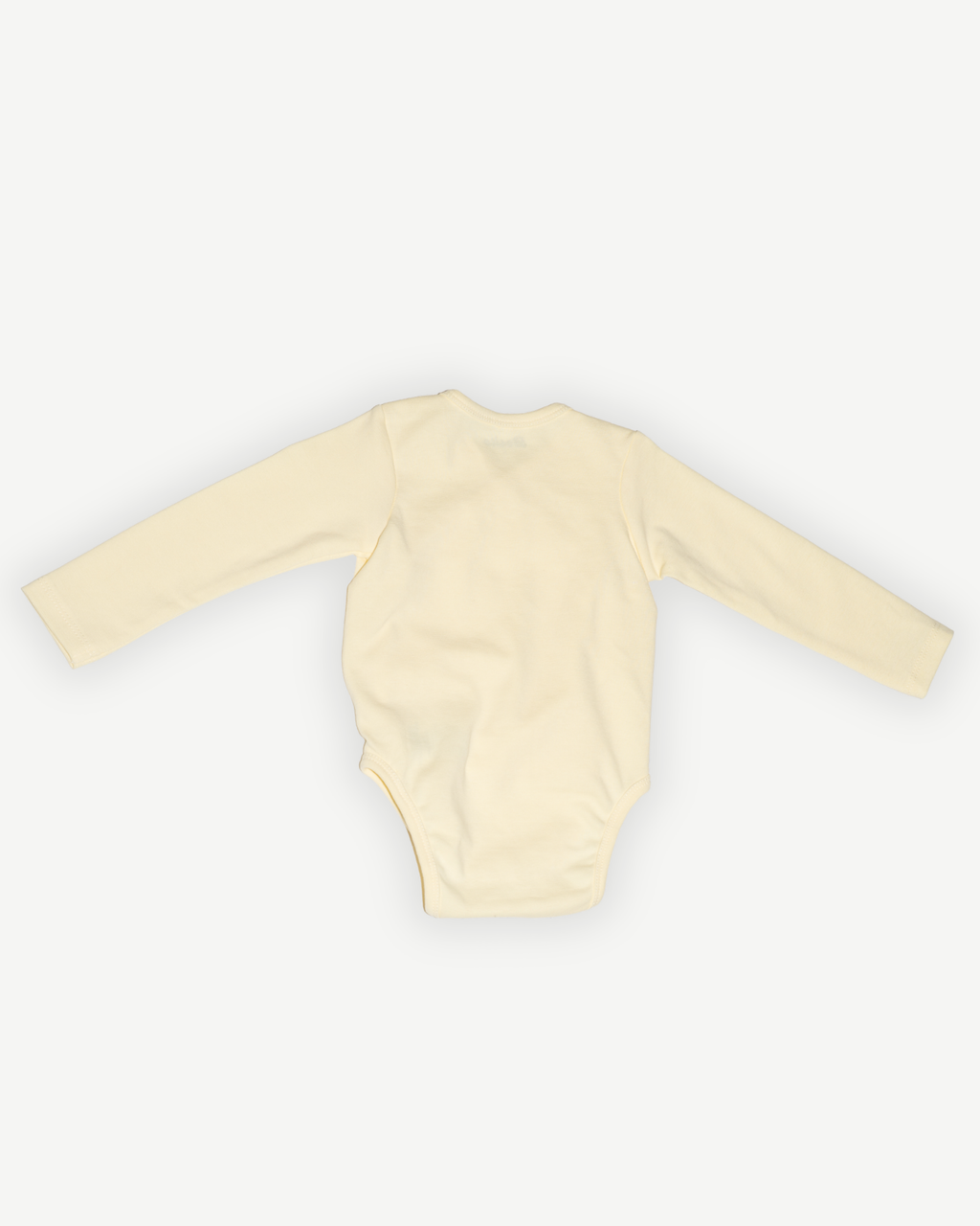 de achterkant van de butter yellow wrap bodysuit van besito baby