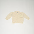 de voorkant van de perfect cardigan in butter yellow van merino wol van besito baby