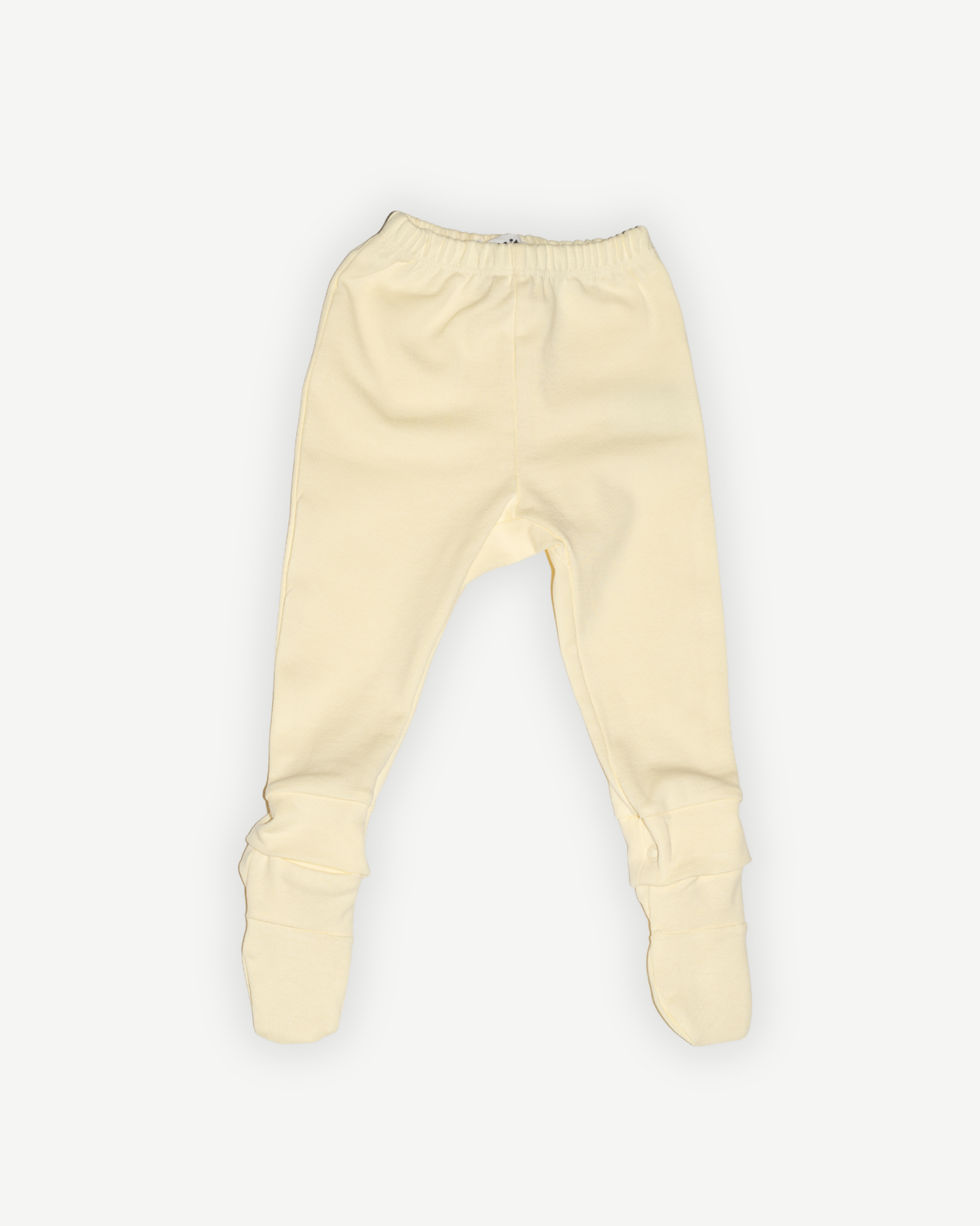 de voorkant van de modulaire babylegging van besito baby in butter yellow