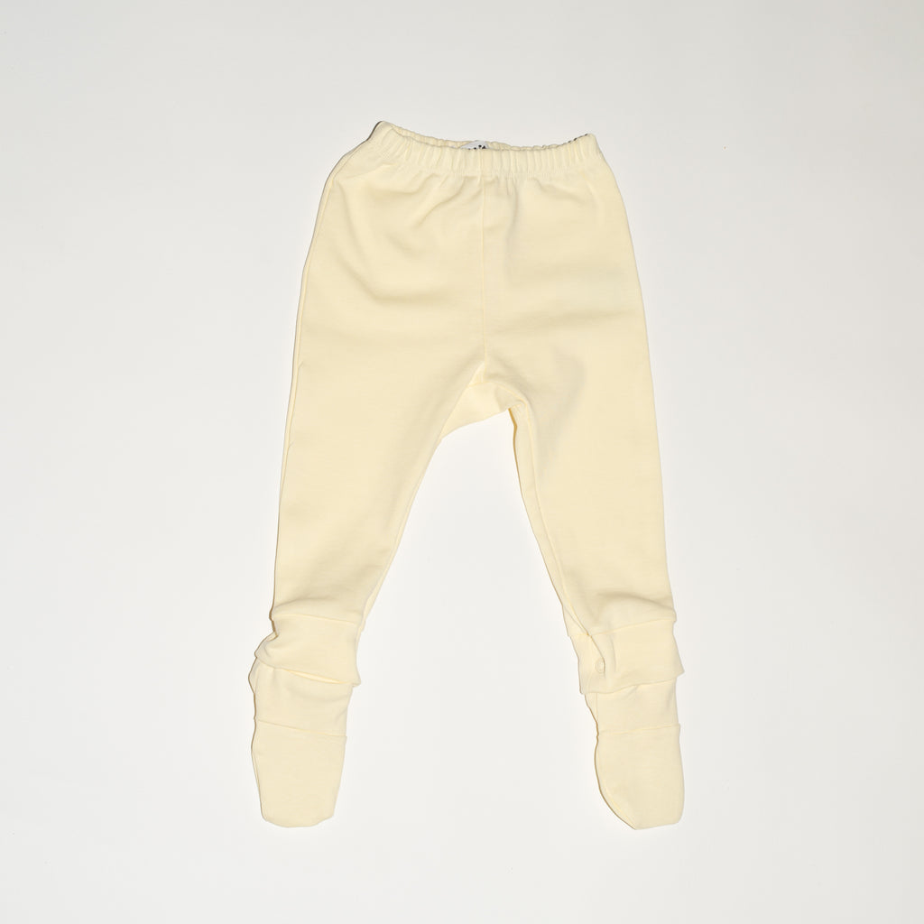 de voorkant van de modular legging van besito baby in butter yellow
